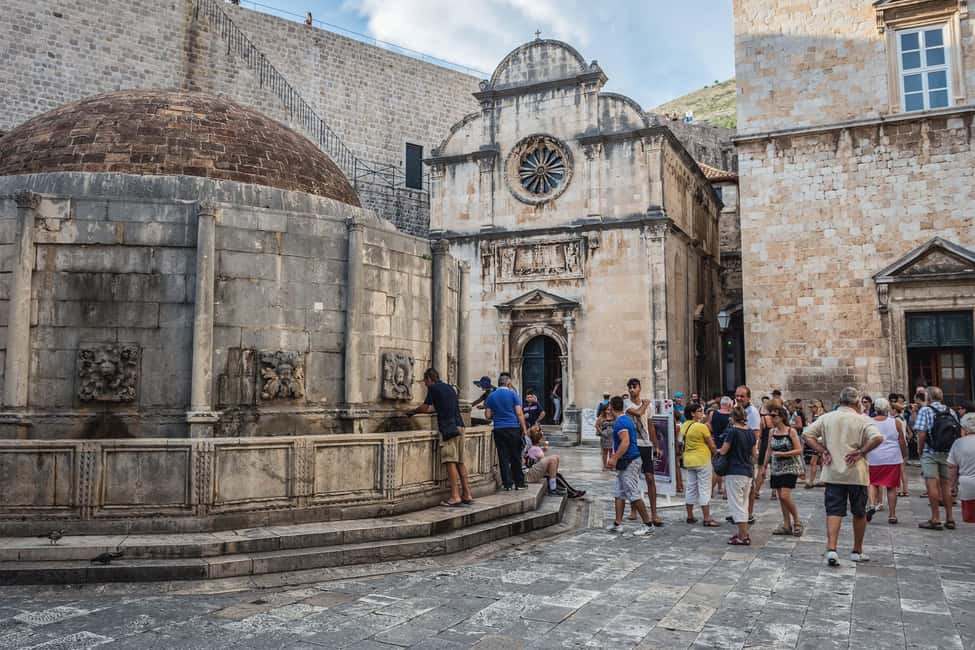 Dubrovnik: City Walls, Old Town Walking Tour & Adriatic View - Luža Square and the Clock Tower moment