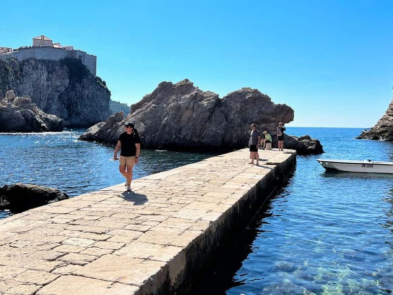 Dubrovnik: City Walls, Old Town Walking Tour & Adriatic View - Old City Harbor walk: where the sea stops being background