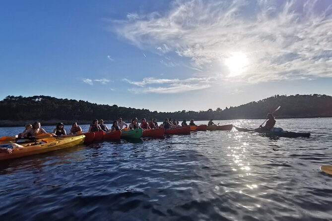 Dubrovnik: Sunset Kayak & Snorkel Tour with Wine & Water - The Old Town return: views from the water beat photos