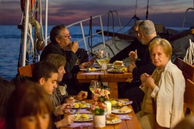 Gastro Cruise | Dinner and Boat ride around Dubrovnik Old Town - City Walls at night: the first act with snacks and dinner